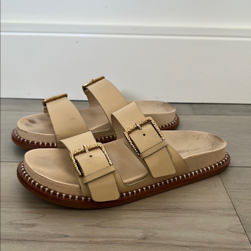 Ulla Johnson Tan Sandals with gold buckles.